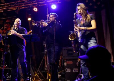 Full horn section in a live show