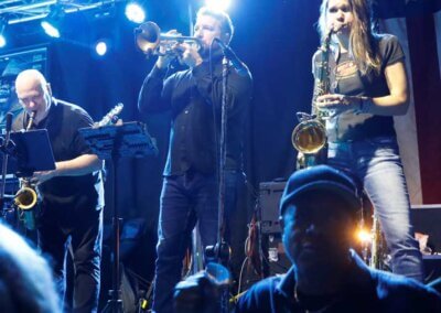 Full horn section in a live show